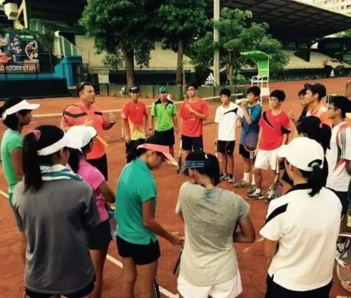 Marcel Petit briefing a junior squad before practice